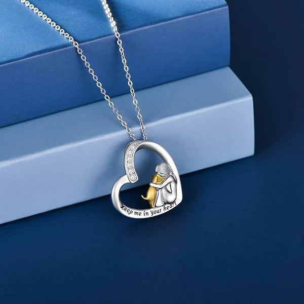 Halsketting met hart van zilver met hond en zirconia stenen